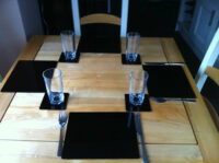 A photo of Set of 6 Perspex Place Mats and Coasters (Black)
